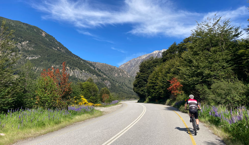 A cyclist on an empty road in Patagonia