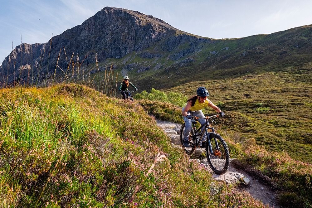 Two women mountain biking in Scotland