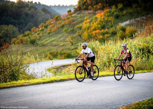 Two cyclists road cycling in Piedmont, Italy