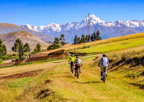 Group mountain biking in the Sacred Valley of the Incas on a guided tour in Peru